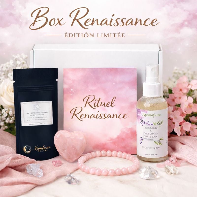 Coffret Box Renaissance édition limitée ouvert présentant ses contenus : pochon noir Bonheur de Lune, livret rose « Rituel Renaissance », spray Aromafume Lavender & Californian White Sage, cœur en quartz rose et bracelet perles roses, sur fond floral pastel.